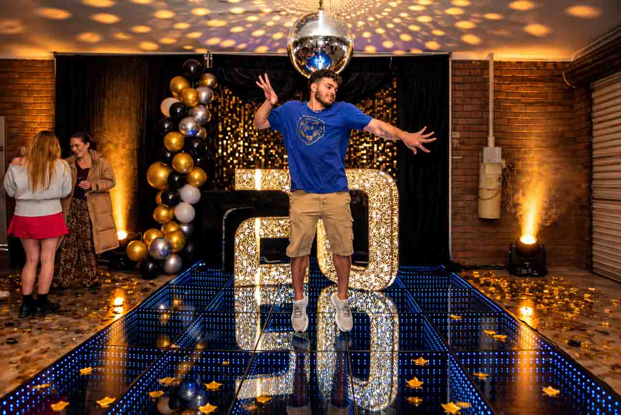 Young guest enjoying a luxury illuminated dance floor