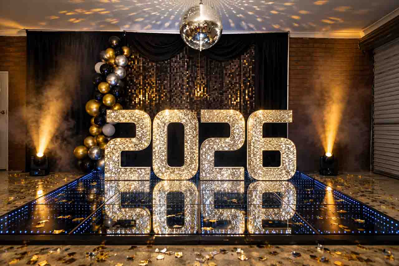 Luxury LED dance floor and illuminated 2026 numbers at an event